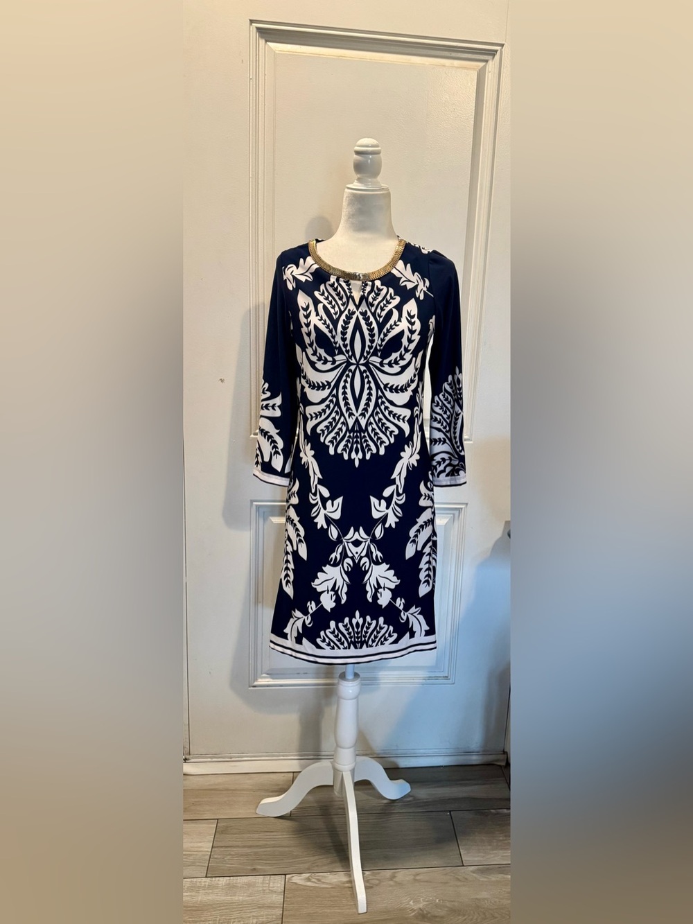 Navy Blue and white formal print with a gold detail on neckline size M